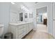 Bathroom showcasing the double sink with storage, toilet, and entrance to the bedroom at 1319 Leland Dr # 101, Sun City Center, FL 33573