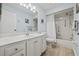 Bright bathroom with walk-in shower, marble countertop, and neutral colors at 1319 Leland Dr # 101, Sun City Center, FL 33573