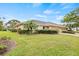 Lovely single-story home featuring a well-kept lawn, mature landscaping, and a convenient two-car garage at 1319 Leland Dr # 101, Sun City Center, FL 33573