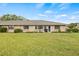 Charming home with a well-maintained front yard and landscaping at 1319 Leland Dr # 101, Sun City Center, FL 33573