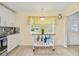 Cozy kitchen nook featuring a prep table, natural light, and ample countertop space at 1319 Leland Dr # 101, Sun City Center, FL 33573