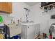 Functional laundry room with a washer, dryer, and sink at 1319 Leland Dr # 101, Sun City Center, FL 33573