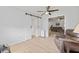 Comfortable living room with barn doors leading to other rooms, perfect for relaxation and entertaining at 1319 Leland Dr # 101, Sun City Center, FL 33573