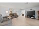 Spacious living room boasts lots of natural light and modern floors at 1319 Leland Dr # 101, Sun City Center, FL 33573