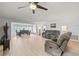 Open-concept living room featuring luxury vinyl floors, neutral walls, and natural light at 1319 Leland Dr # 101, Sun City Center, FL 33573