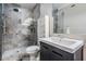 Elegant bathroom featuring a tiled shower with glass door and modern vanity at 1810 E Palm Ave # 4304, Tampa, FL 33605