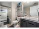 Bathroom with shower-tub combo, decorative mirror, and single sink vanity at 1810 E Palm Ave # 4304, Tampa, FL 33605