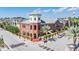 Corner building with red brick, a charming tower, street parking, and a view of the nearby water tower at 1810 E Palm Ave # 4304, Tampa, FL 33605