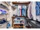 Organized closet with metal shelving, wooden rods, and shoe racks for storage at 1810 E Palm Ave # 4304, Tampa, FL 33605