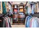 Walk-in closet with organized shelving, rods for hanging clothes, and shoe storage at 1810 E Palm Ave # 4304, Tampa, FL 33605