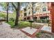 Charming courtyard with barbecue, mature trees and lush landscaping in residential community at 1810 E Palm Ave # 4304, Tampa, FL 33605