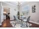 Cozy dining area features a glass table and views to the adjacent bedroom at 1810 E Palm Ave # 4304, Tampa, FL 33605