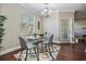 Bright dining room featuring a glass table with modern chairs and a stylish rug at 1810 E Palm Ave # 4304, Tampa, FL 33605
