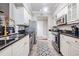 Modern kitchen features sleek appliances, granite countertops, and white cabinetry at 1810 E Palm Ave # 4304, Tampa, FL 33605