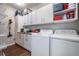 Well-organized laundry room with ample storage cabinets, countertop space, and a modern washer and dryer at 1810 E Palm Ave # 4304, Tampa, FL 33605