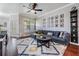 Comfortable living room with gray sofa, stylish ceiling fan, and decorative rug at 1810 E Palm Ave # 4304, Tampa, FL 33605