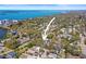Detailed aerial photo highlighting the property's location within a lush neighborhood with close proximity to the water at 1874 N Washington Ave, Clearwater, FL 33755