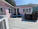 Relaxing back porch with comfortable seating and table for outdoor dining or lounging at 1874 N Washington Ave, Clearwater, FL 33755