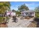 Backyard with an outdoor patio area with comfortable seating and manicured landscaping at 1874 N Washington Ave, Clearwater, FL 33755
