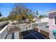 The backyard patio offers an outdoor dining area with a glass-top table at 1874 N Washington Ave, Clearwater, FL 33755