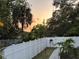 Fenced backyard with landscaped garden at 1874 N Washington Ave, Clearwater, FL 33755