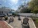 Well-maintained backyard featuring a firepit, chairs, and lush landscaping at 1874 N Washington Ave, Clearwater, FL 33755