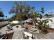 Well maintained backyard featuring rock, fountains, chairs, a firepit, and lush landscaping at 1874 N Washington Ave, Clearwater, FL 33755
