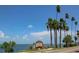 Welcome to Dunedin sign along the water with palm trees, offering a beautiful coastal community feel at 1874 N Washington Ave, Clearwater, FL 33755