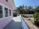This backyard deck provides an intimate gathering spot to enjoy the lush backyard landscaping at 1874 N Washington Ave, Clearwater, FL 33755
