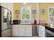 Well-lit kitchen with stainless steel appliances, butcher block countertops, and white subway tile backsplash at 1874 N Washington Ave, Clearwater, FL 33755