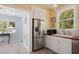 Bright kitchen featuring stainless steel appliances, white cabinets, and a wood countertop at 1874 N Washington Ave, Clearwater, FL 33755