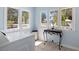 Bright laundry room featuring three windows allowing for ample natural light at 1874 N Washington Ave, Clearwater, FL 33755