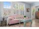 Sun-filled living room featuring hardwood floors, large windows, and cozy seating at 1874 N Washington Ave, Clearwater, FL 33755