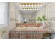 Well-lit bathroom with double sinks, decorative tile, and stylish fixtures at 222 Mar St, St Pete Beach, FL 33706