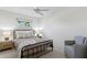 Simple bedroom with a comfortable bed, natural light, and a relaxing ambiance at 222 Mar St, St Pete Beach, FL 33706