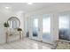 Bright foyer with tiled floors, double doors, stylish mirror, and decorative accents, offering a welcoming entrance at 222 Mar St, St Pete Beach, FL 33706
