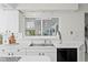 Bright and airy kitchen with white countertops and ample cabinet space at 222 Mar St, St Pete Beach, FL 33706