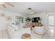 Spacious living room with tile floors and modern decor; light and airy at 222 Mar St, St Pete Beach, FL 33706