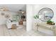 Bright and open living room with tile flooring, comfortable seating, and serene views, perfect for relaxation at 222 Mar St, St Pete Beach, FL 33706