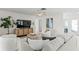 Bright living room featuring a modern entertainment center and stylish, comfortable seating at 222 Mar St, St Pete Beach, FL 33706