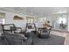 Relaxing sunroom featuring wicker furniture, stylish decor, and scenic views at 222 Mar St, St Pete Beach, FL 33706