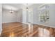 Bright foyer featuring wood floors and a beveled glass front door with arched transom at 22819 Eagles Watch Dr, Land O Lakes, FL 34639