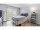Well-lit bedroom with a large window, wardrobe, and tiled floors, offering plenty of space and storage at 2625 State Road 590 # 2612, Clearwater, FL 33759