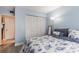 Bright blue bedroom with a large window and closet, providing plenty of natural light and storage space at 2625 State Road 590 # 2612, Clearwater, FL 33759