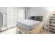 Cozy bedroom featuring a window, wardrobe, and tiled floors, offering comfort and functionality at 2625 State Road 590 # 2612, Clearwater, FL 33759