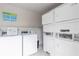 Community laundry room featuring coin operated machines at 2625 State Road 590 # 2612, Clearwater, FL 33759