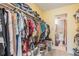 Spacious walk-in closet providing plentiful storage, leading to bathroom at 2625 State Road 590 # 2612, Clearwater, FL 33759