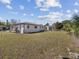 Spacious backyard with a well-maintained lawn, partial fencing and ample space for outdoor activities at 2901 W Nassau St, Tampa, FL 33607