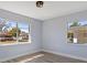 Bedroom with two windows offering ample natural light and views of the surrounding neighborhood at 2901 W Nassau St, Tampa, FL 33607