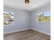 Bright bedroom with views from two windows and wood-look flooring at 2901 W Nassau St, Tampa, FL 33607